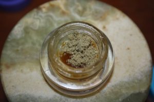 Photo of kief atop melted Sugar Crumble